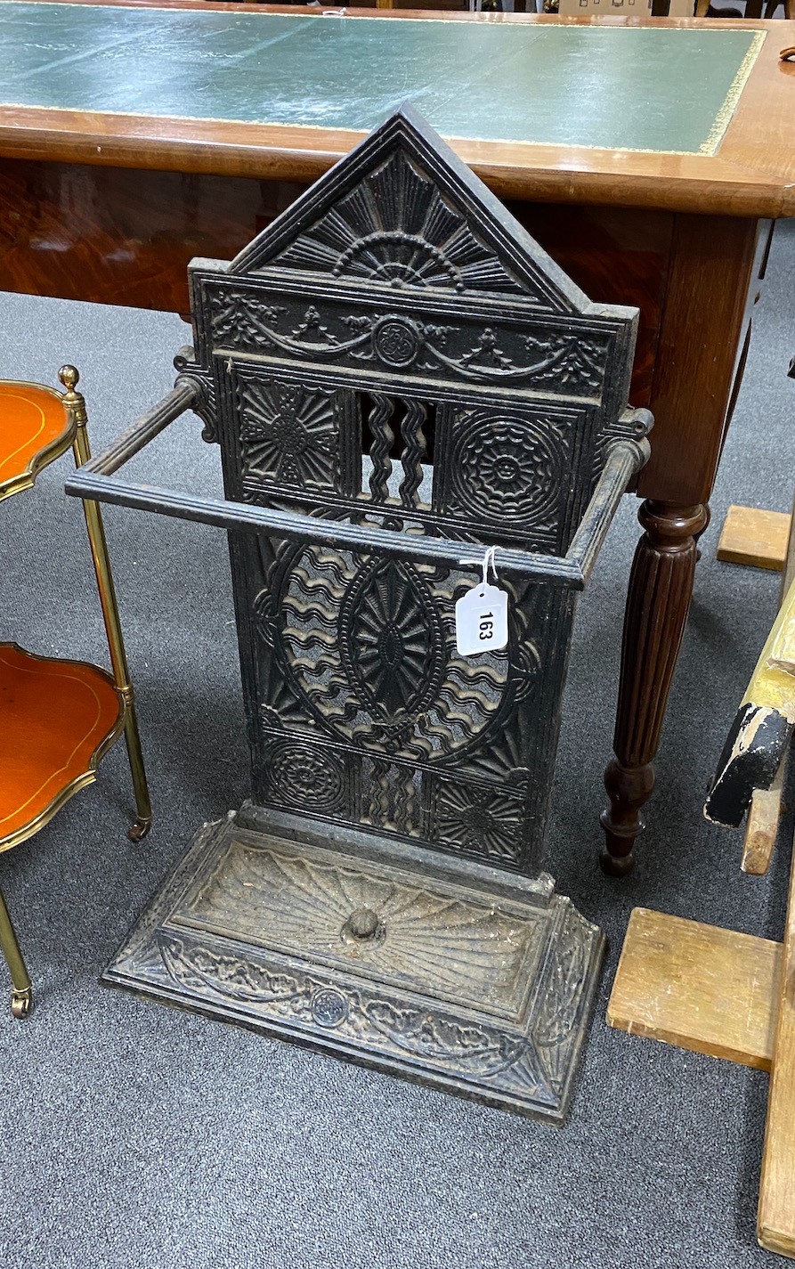 A Victorian Coalbrookdale style cast iron stick stand with pierced paterae decoration width 41cm, depth 20cm, height 80cm.